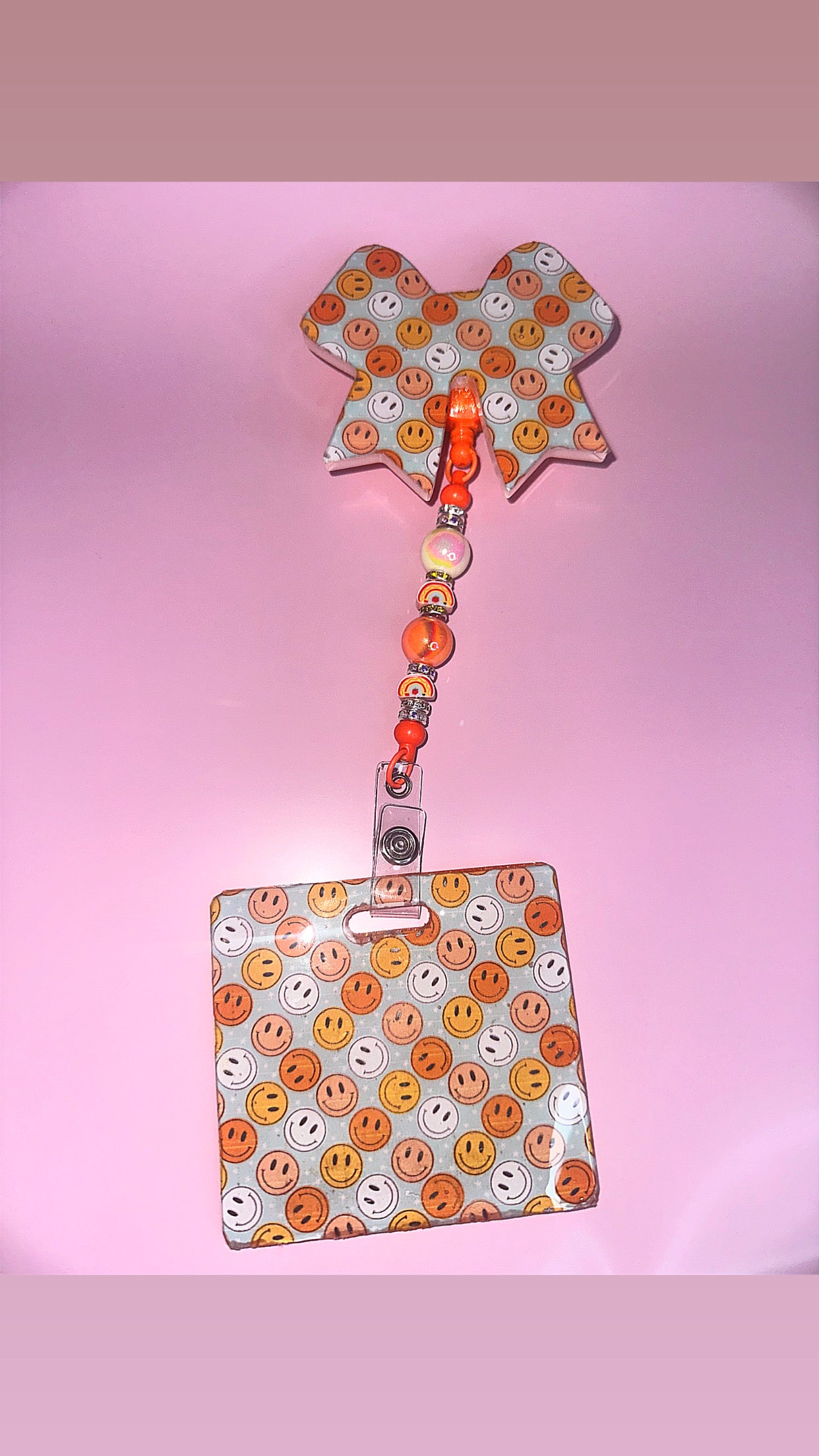 Smiley face badge reel