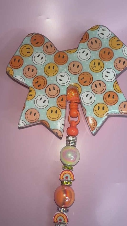 Smiley face badge reel